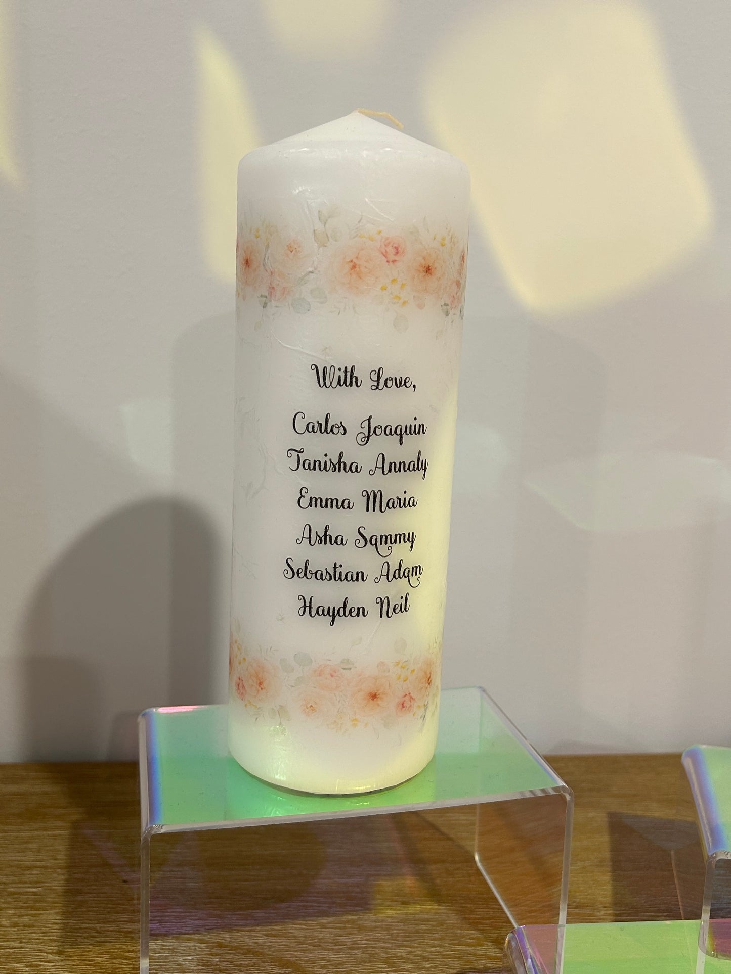 Baptism candles and a godparent candle