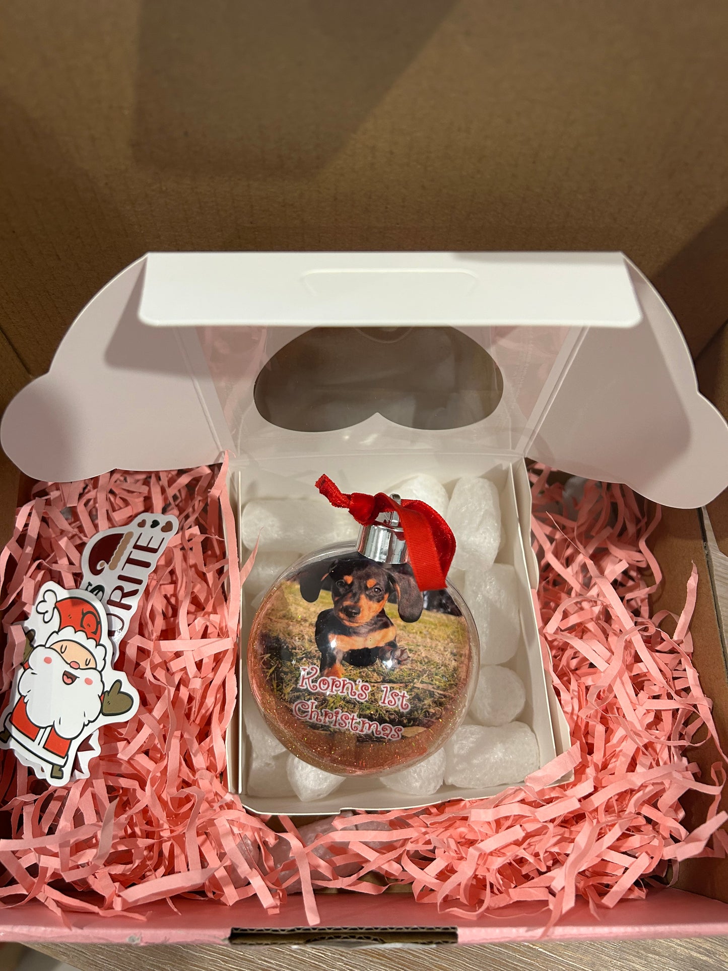 Photo bauble for their puppy’s first Christmas 