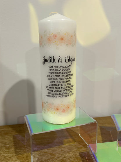 Baptism candles and a godparent candle