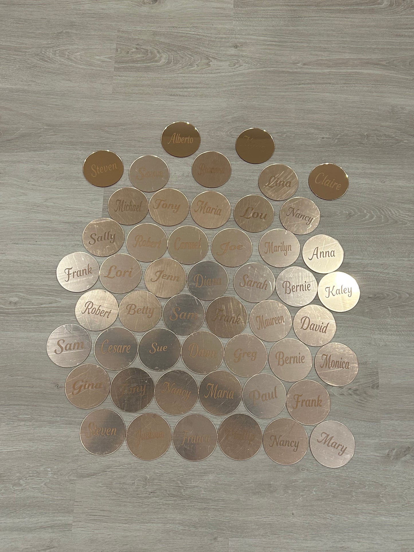 50 coasters in rose gold - mirror finish (most still have the protective layer on)