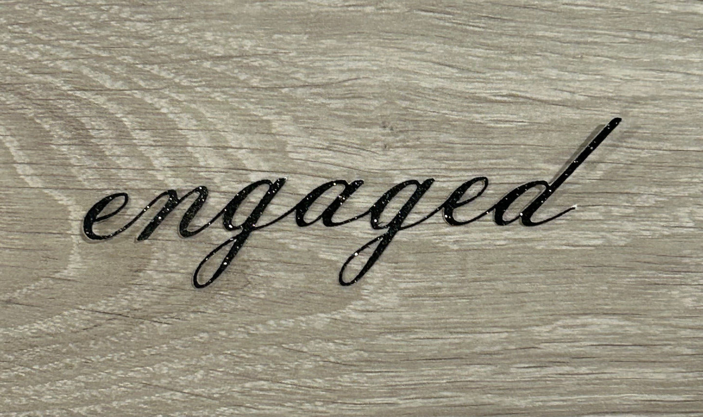 “Engaged” cake topper