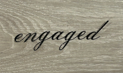 “Engaged” cake topper