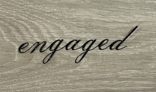 “Engaged” cake topper