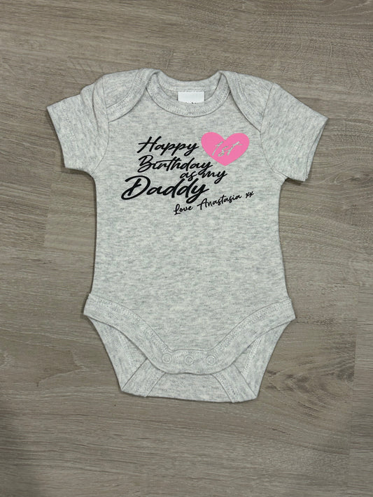 A onesie for daddy’s first birthday with her