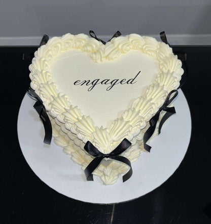“Engaged” cake topper